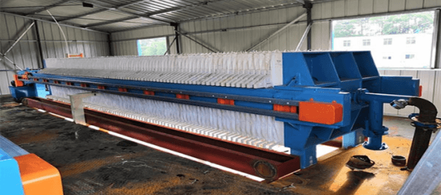 Plate and frame press for sludge dewatering
